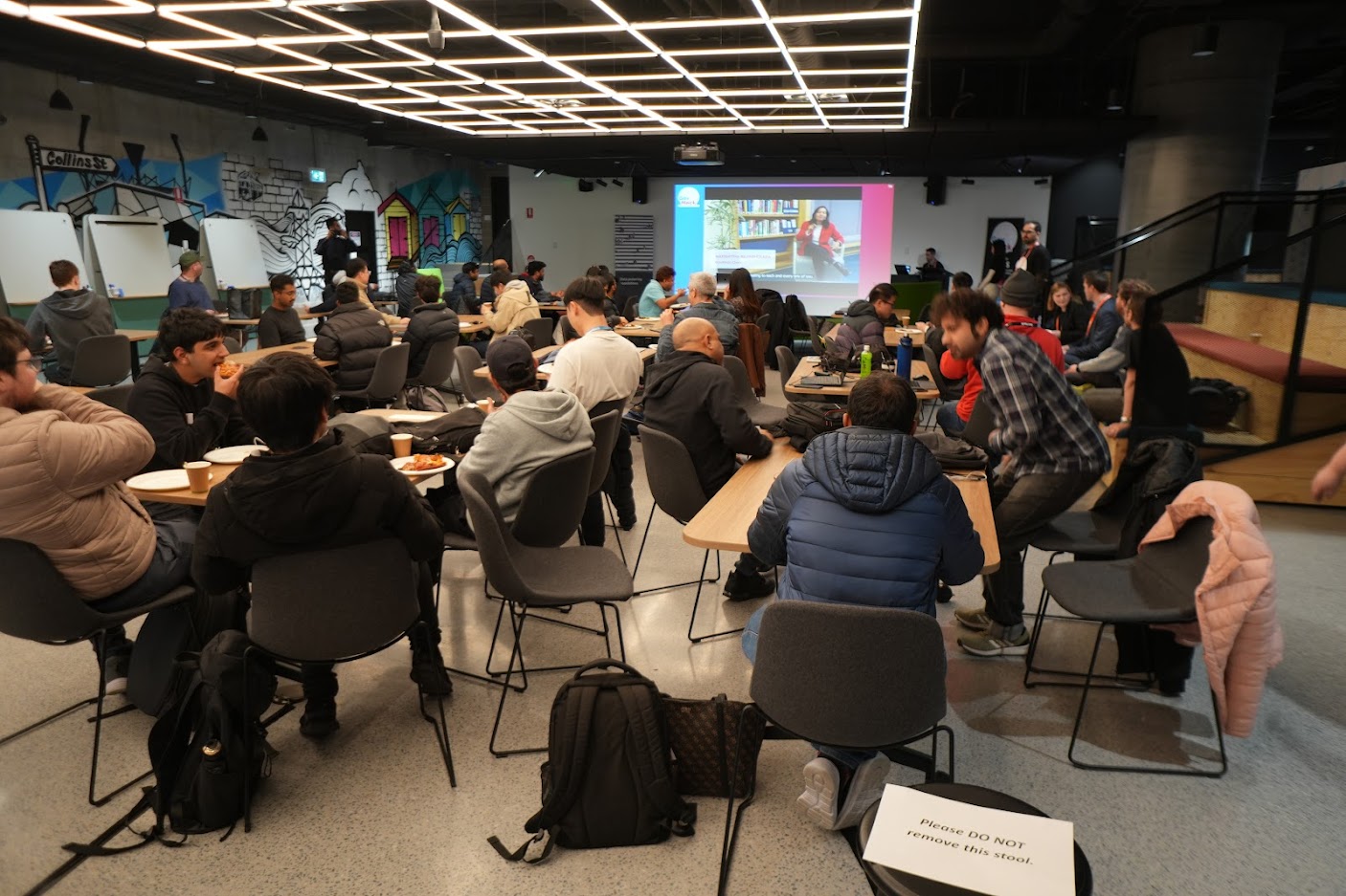Group of people watching opening presentation